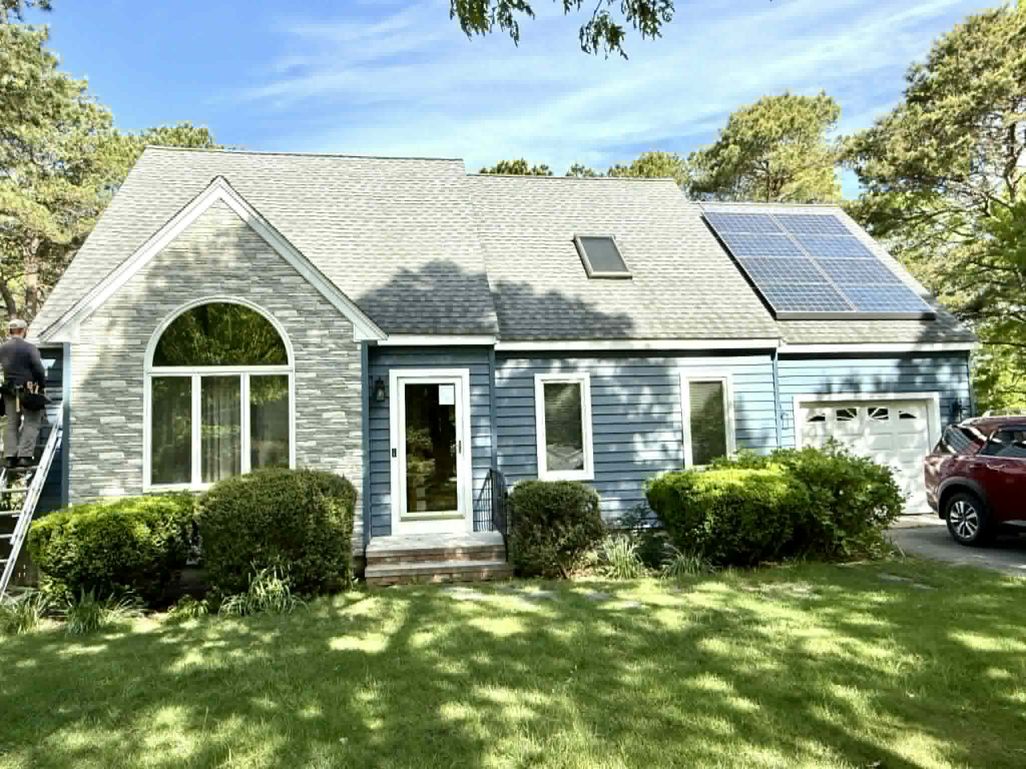 New home with premium white siding and wrap-around porch
