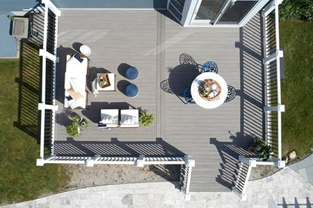 Aerial view of composite deck with outdoor furniture and privacy screens